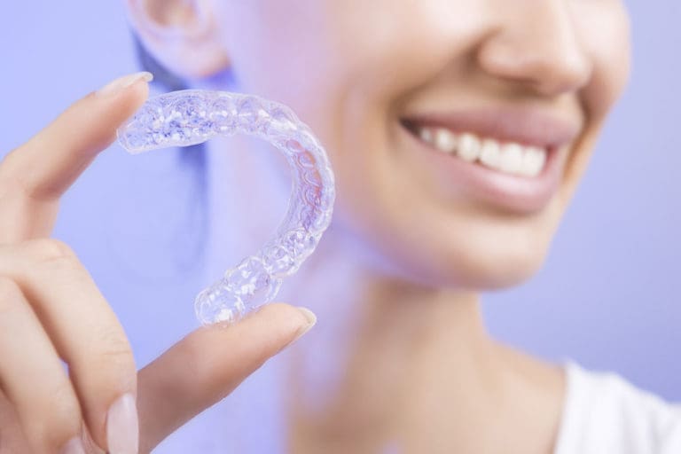 Invisalign dentist patient with clear aligners